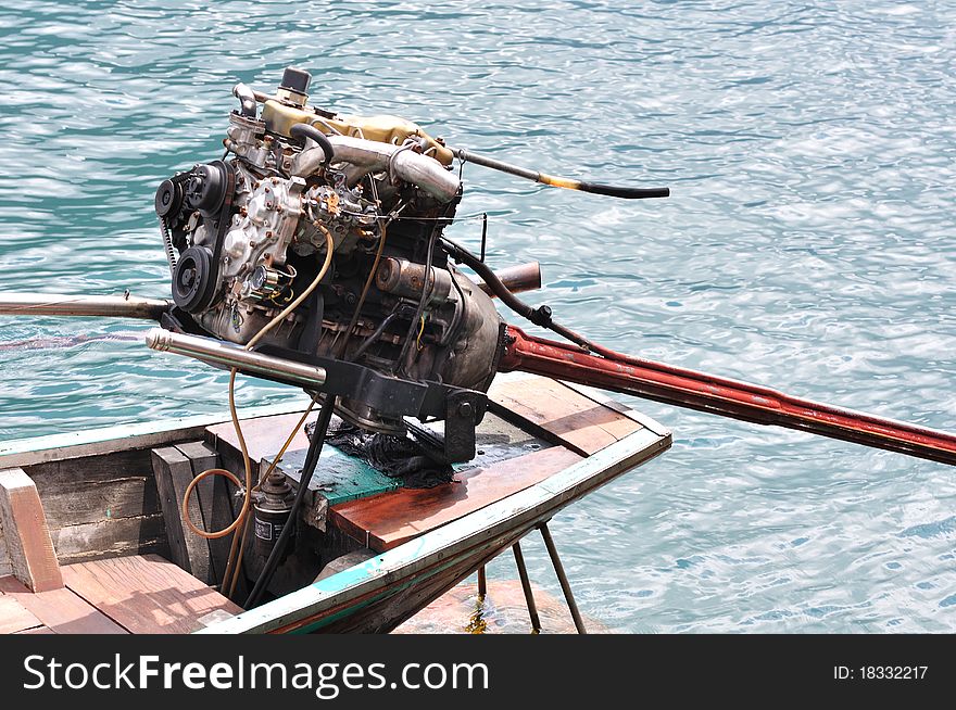 Close up of engine of long tailed boat.