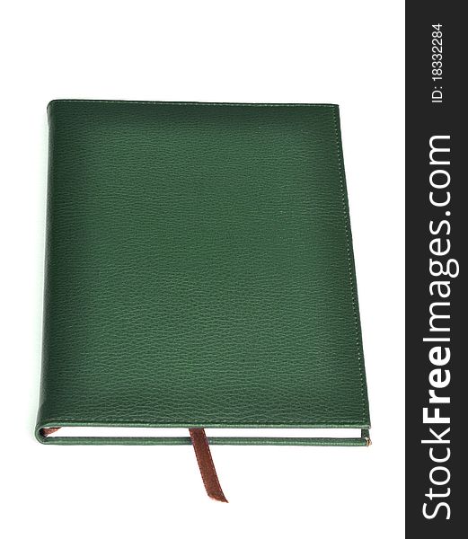 Dark green leather notebook on white background.