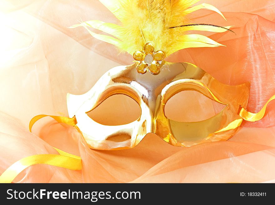 Golden mask on the fabric
