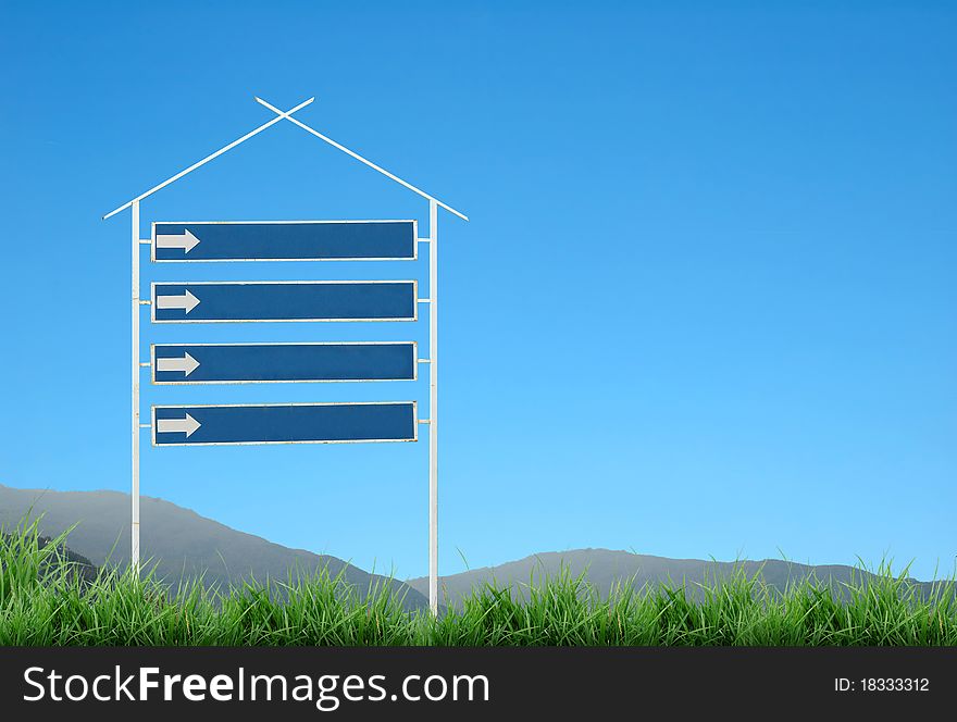 Signpost with mountain and blue sky