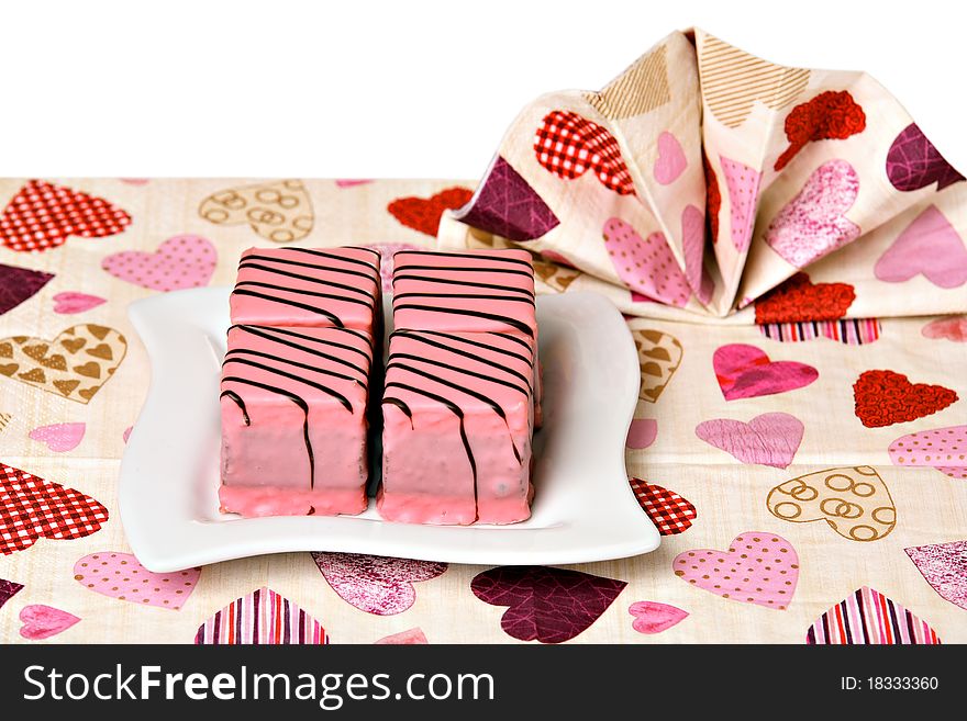 Pink cakes on white ceramic plate