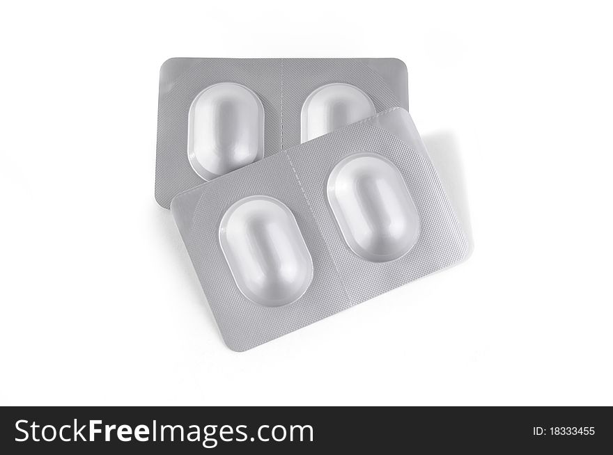 Silver medicine blister packs on white isolate background. Silver medicine blister packs on white isolate background