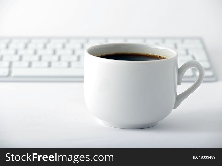 Cup with coffee and keybord. Cup with coffee and keybord