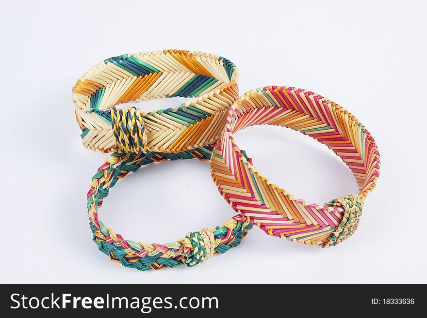 Three Thai style grass weave bracelets in many colours.