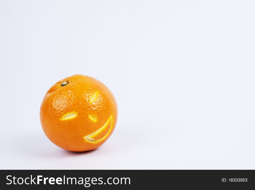 Remove some part of orange surface to be a smiley face Chinese style. Remove some part of orange surface to be a smiley face Chinese style.