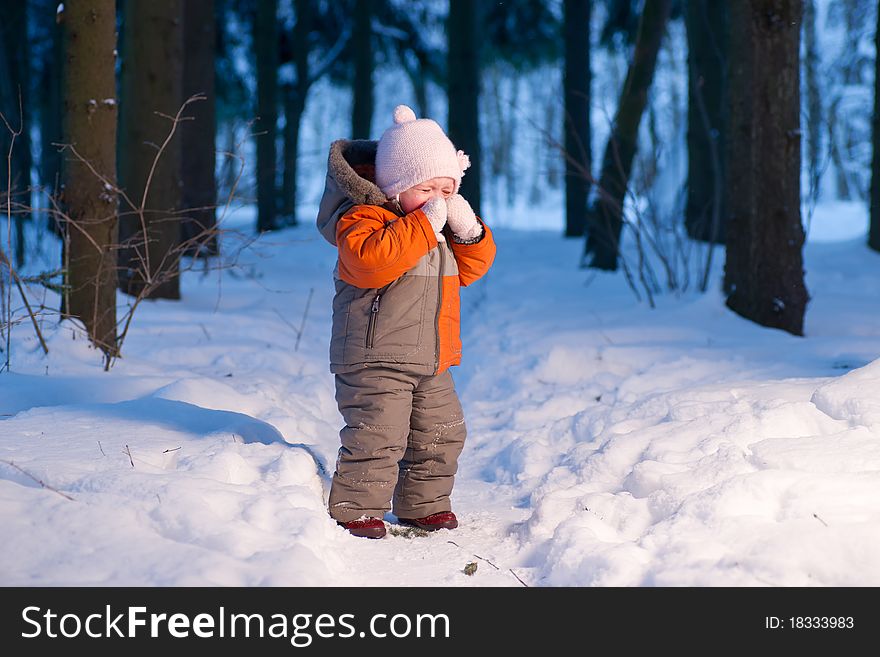 Cute adorable baby cry on snow road in winter forest at evening. Cute adorable baby cry on snow road in winter forest at evening