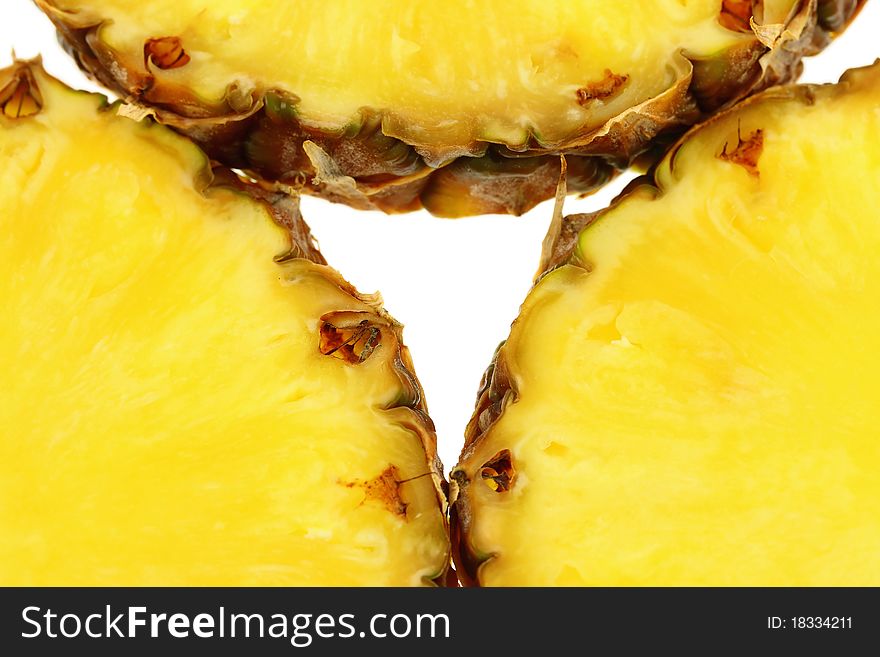 Juicy slices of pineapple, isolated on white background.