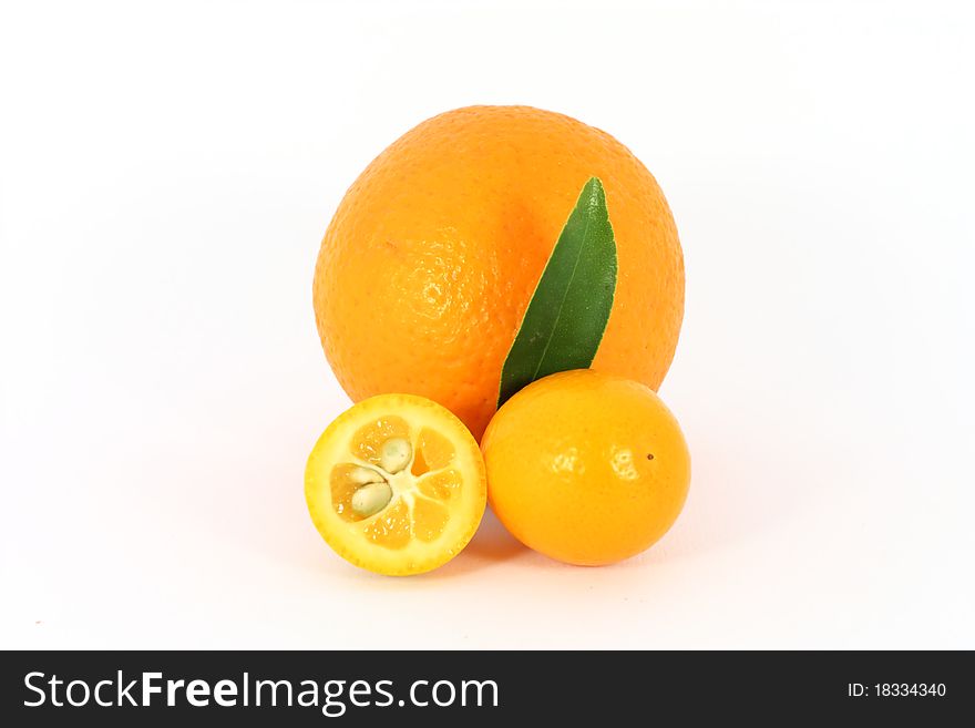 Ripe orange and kumquat isolated on white