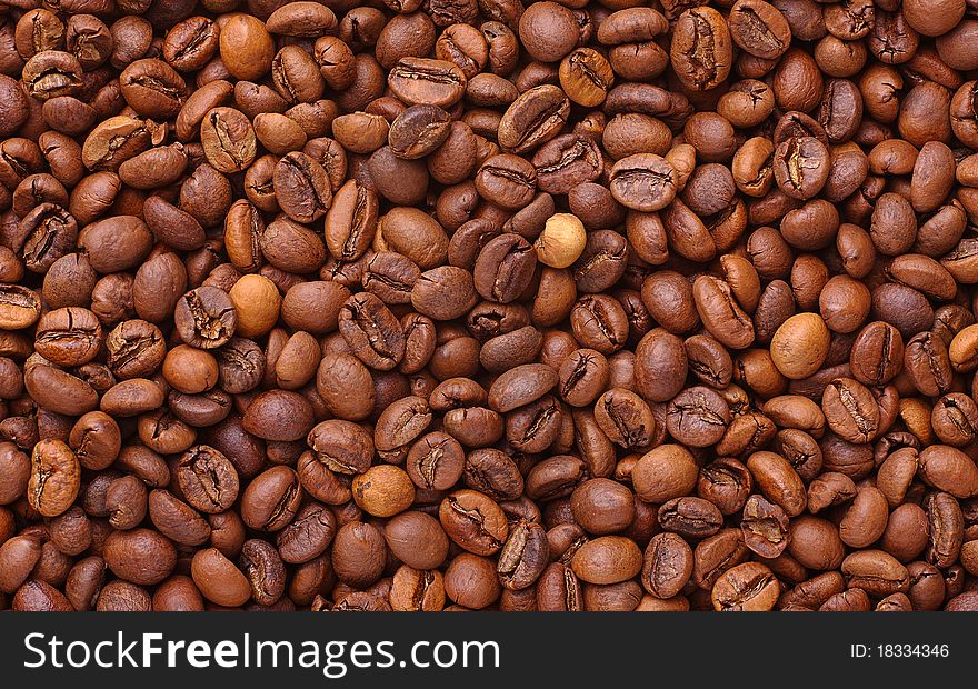 The Arabica. Roasted coffee beans. Background. Texture.