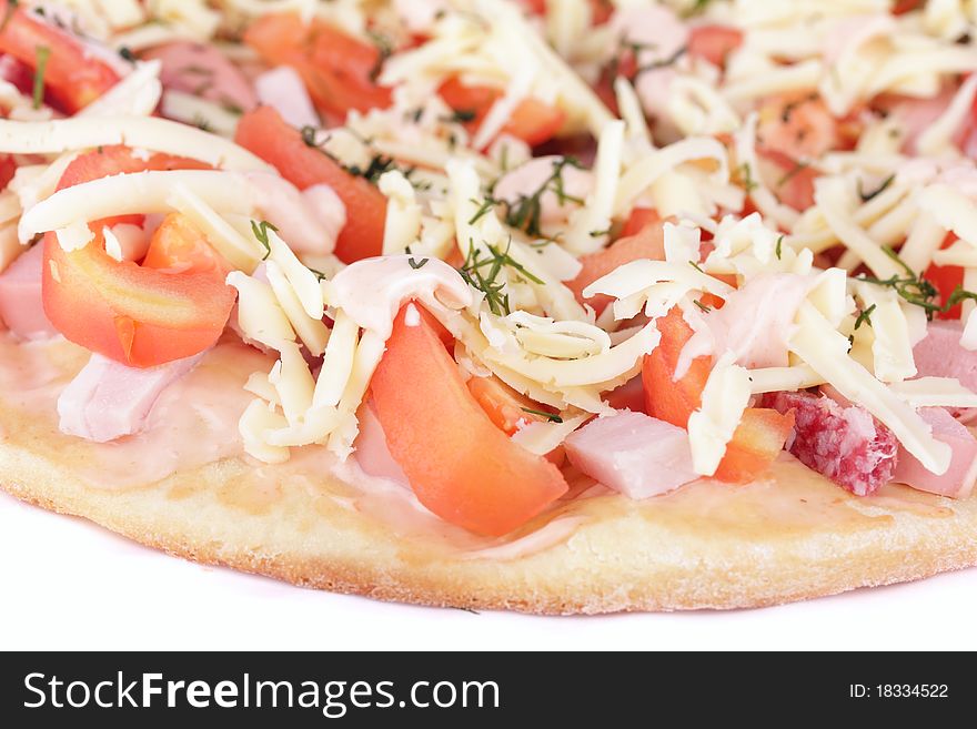 Tasty fresh pizza with tomatoes, sauce, ham, sausage, cheese, dill ready for cooking isolated on white background