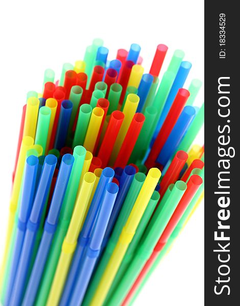 Colorful drinking straws. Focus on foreground. Isolated on white background