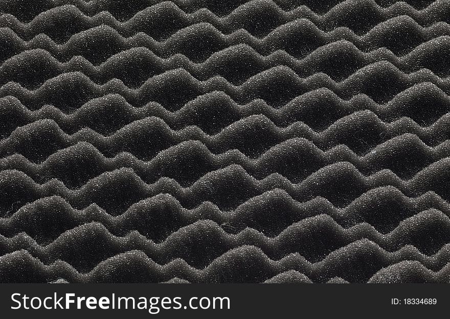 Black plastic insulating material, forming a texture macro photography