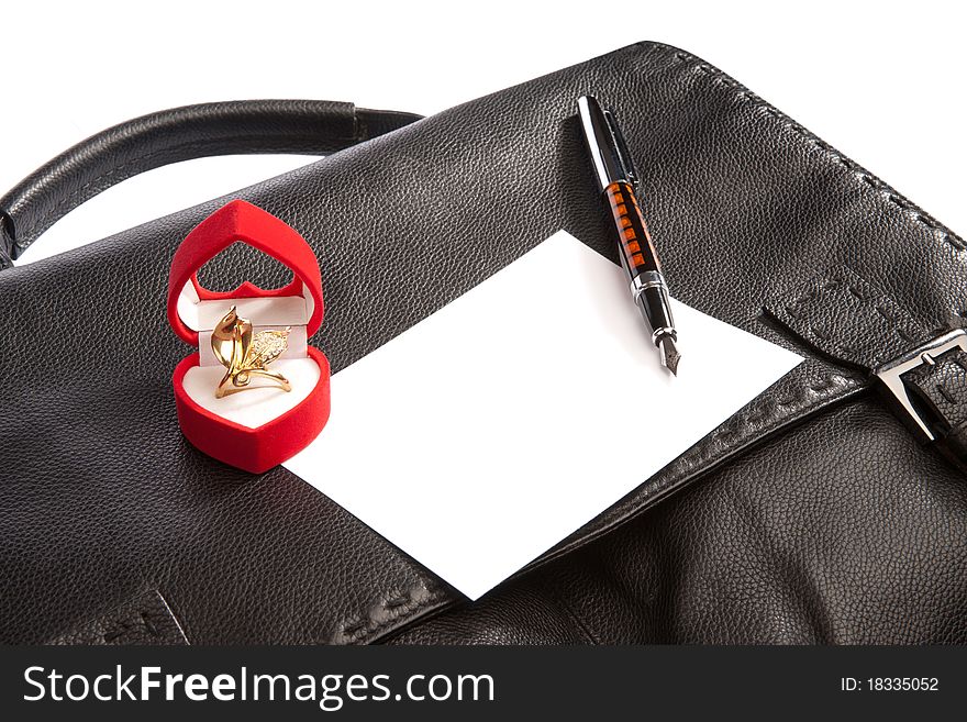 Black briefcase and gift isolated on white background