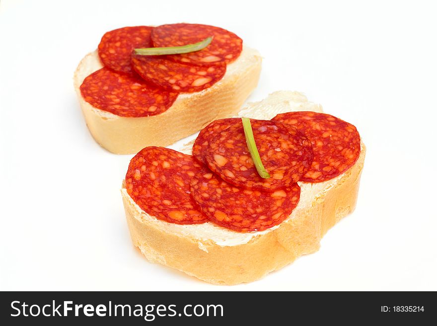 Shot of Bread and salami isolated on white