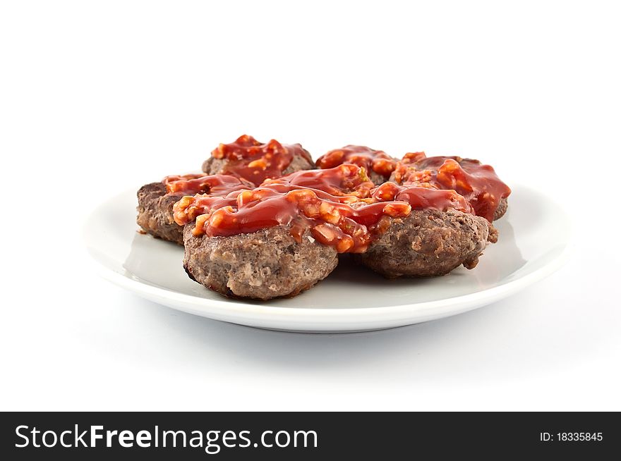 Chops with sauce on a white background