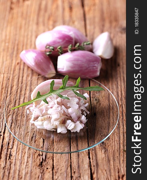 Chopped red onion on a glass plate