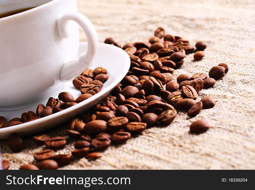 Coffee Cup And Grain On A Fabric. Still-life