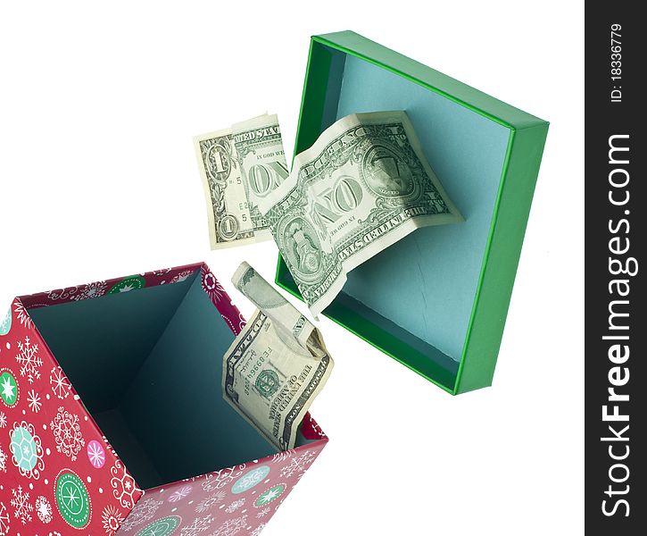 Open Holiday Box with Dollar Bills Spilling Out. Isolated on White with a Clipping Path. Open Holiday Box with Dollar Bills Spilling Out. Isolated on White with a Clipping Path.