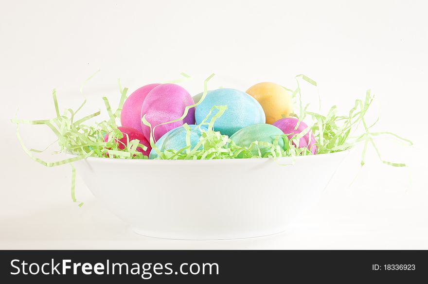 Easter eggs presented in a white bowl. Easter eggs presented in a white bowl