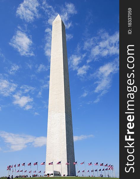Washington Monument in Washington D.C. surrounded by a cirlce of American flags. Washington Monument in Washington D.C. surrounded by a cirlce of American flags