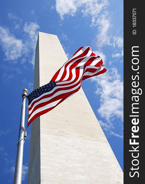 An American flag waves in the wind in front of the Washington Monument in Washington D.C. An American flag waves in the wind in front of the Washington Monument in Washington D.C