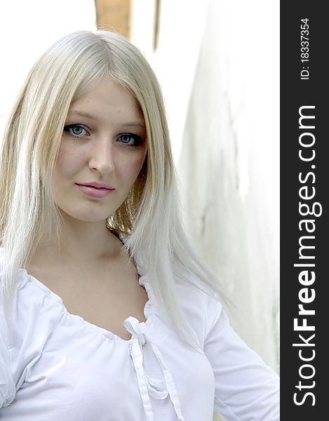 Attractive Blonde Near White Wall