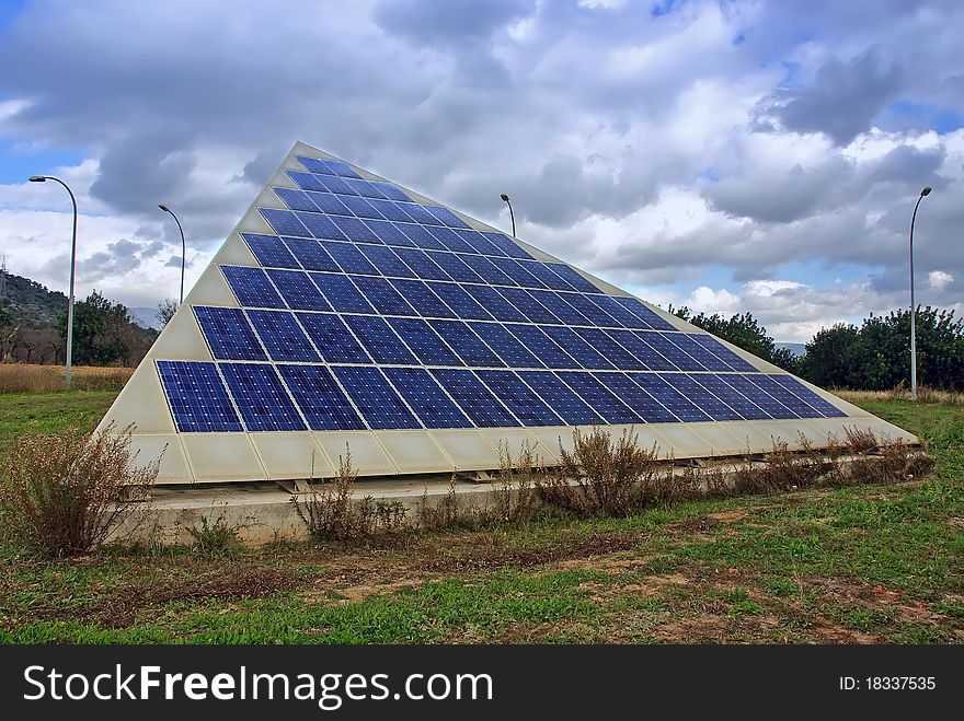 Triangular shape photovoltaic solar panel in a technologic park. Triangular shape photovoltaic solar panel in a technologic park