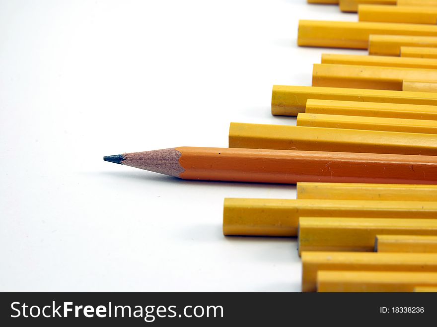 Yellow pencils arranged against a white background.