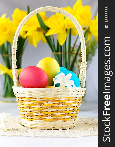 Easter basket with eggs and narcissus flowers. Easter basket with eggs and narcissus flowers