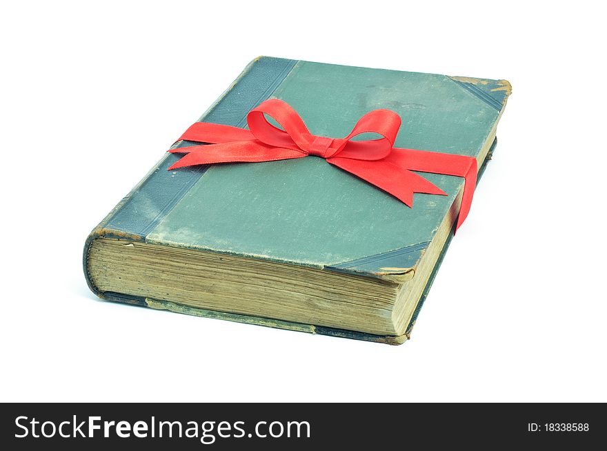 Book old vintage packed as gift with red bow. Book old vintage packed as gift with red bow