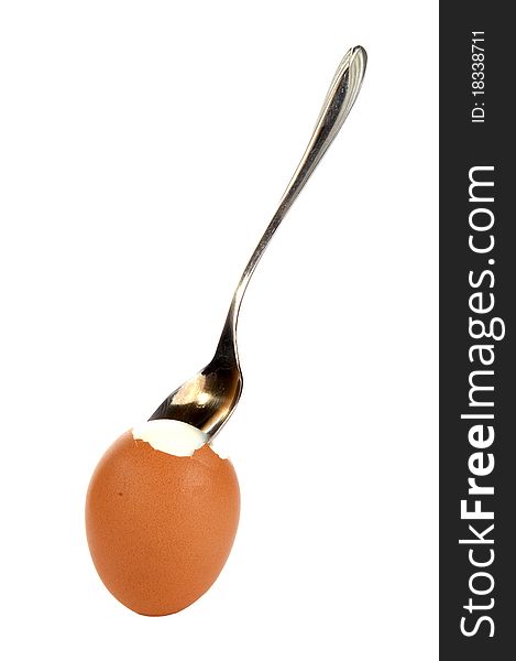 Egg with a small spoon, isolated on a white background