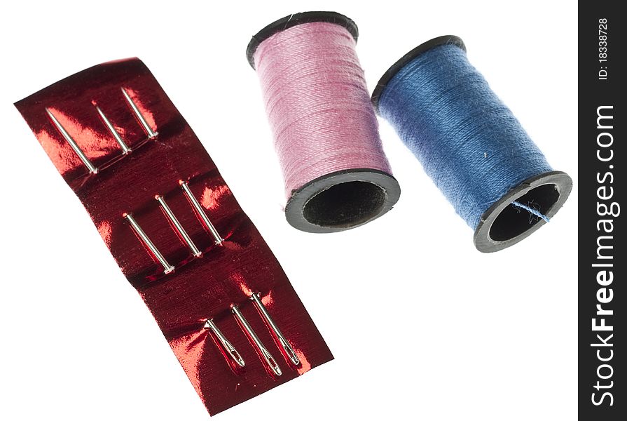Pink and Blue Thread with Needles Isolated on White with a Clipping Path.
