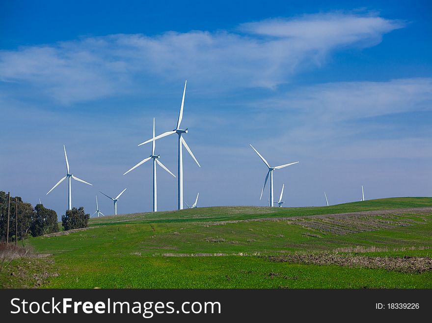 A Wind Farm with blue sky and clouds