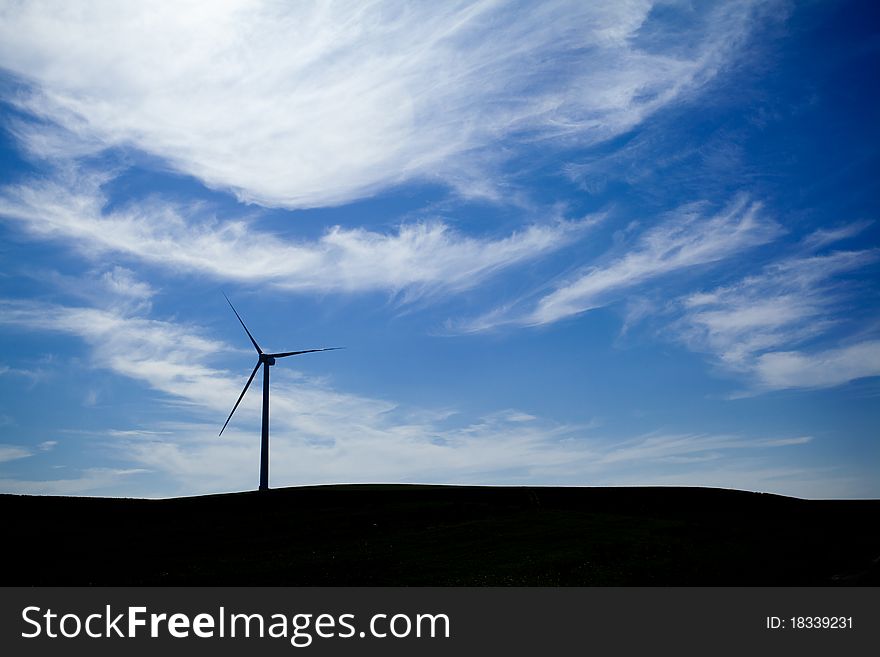 A Wind Farm with blue sky and clouds