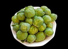 Brussels Cabbage Isolated Over Black Royalty Free Stock Photo