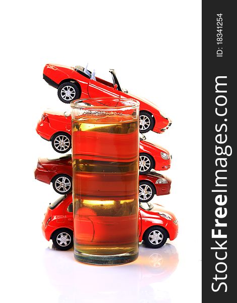 Glass full of beerl with heap of cars  isolated on white background. Glass full of beerl with heap of cars  isolated on white background.
