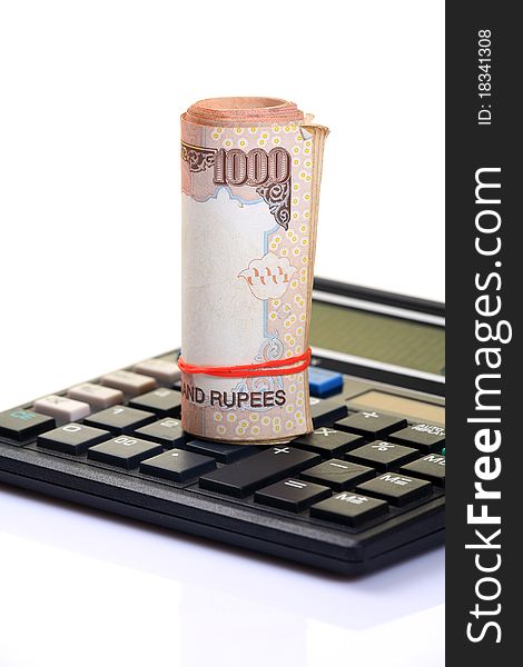 Currency notes and calculator over white background. Currency notes and calculator over white background.