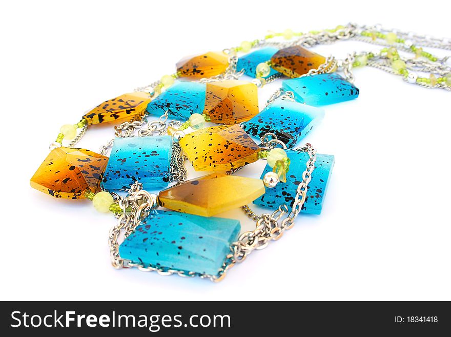 Blue and yellow necklaces isolated on white background.