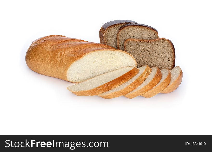 Sliced fresh-baked long loaf and rye bread isolated on white background with clipping path. Sliced fresh-baked long loaf and rye bread isolated on white background with clipping path