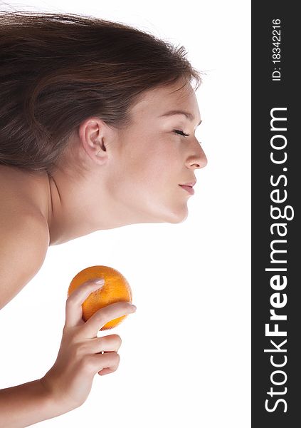 The woman with an orange fruit