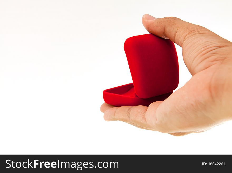 Man hand and ring box on white background