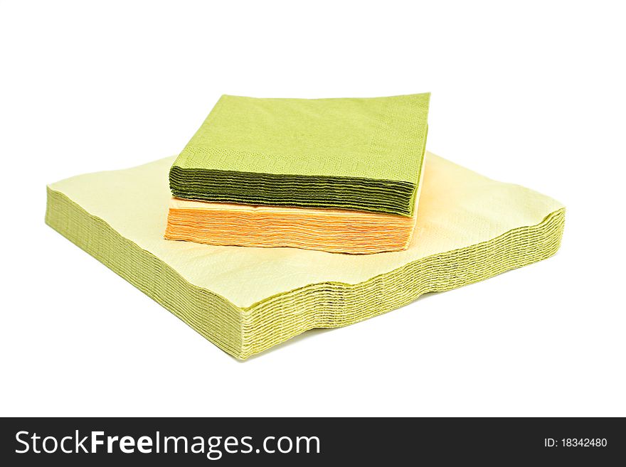 Green and yellow napkins isolated on a white background. Green and yellow napkins isolated on a white background.
