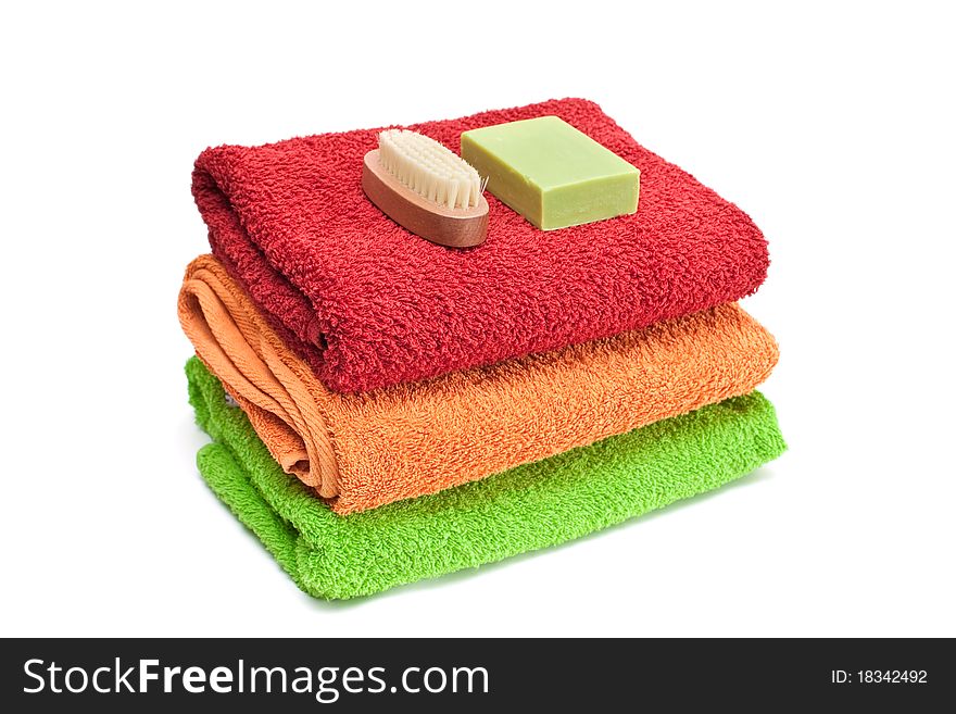 Stacked colorful towels isolated on a white background. Stacked colorful towels isolated on a white background.