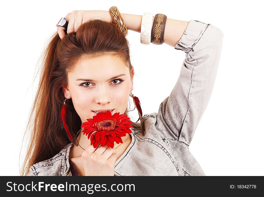 Beautiful girl with red flower near lips on white background