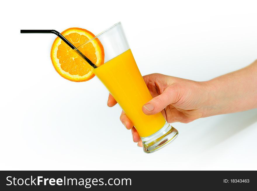 I flow holding long glass with orange juice and orange slice