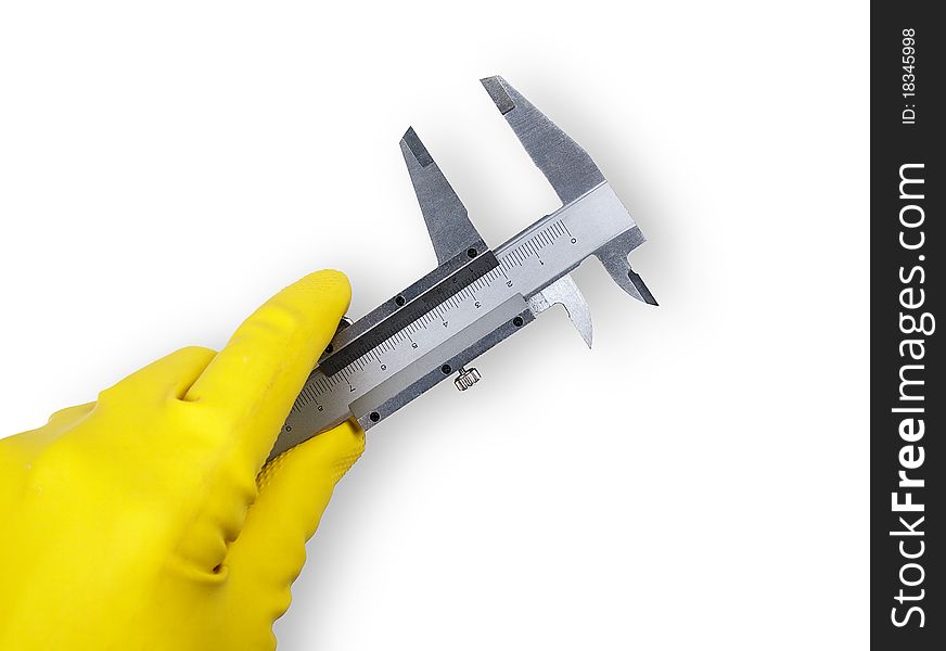 The image shows a human hand with a rubber glove and a sliding gauge over white. The image shows a human hand with a rubber glove and a sliding gauge over white