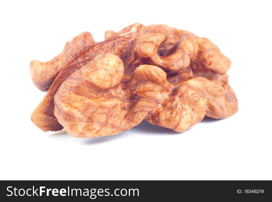 Peeled walnut on white background