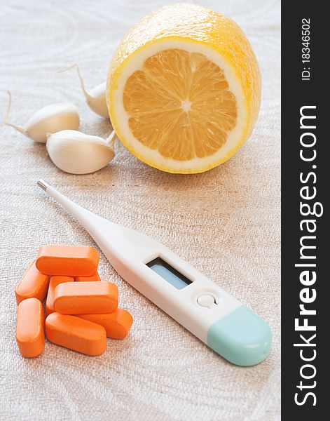Thermometer with garlic, lemon and  pill. Thermometer with garlic, lemon and  pill