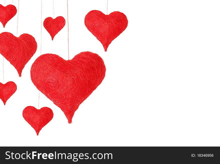 A lot of different red hearts on a string. Isolated on white background. A lot of different red hearts on a string. Isolated on white background