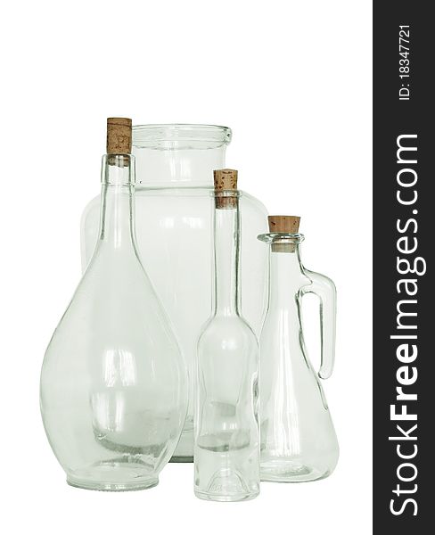 Bottle with corks and jar on white background